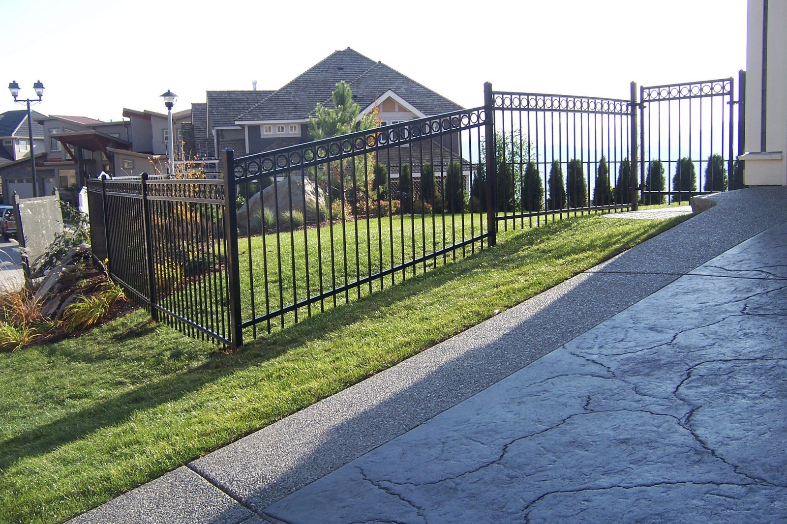 Ornamental iron fence around a yard in the Fraser Valley